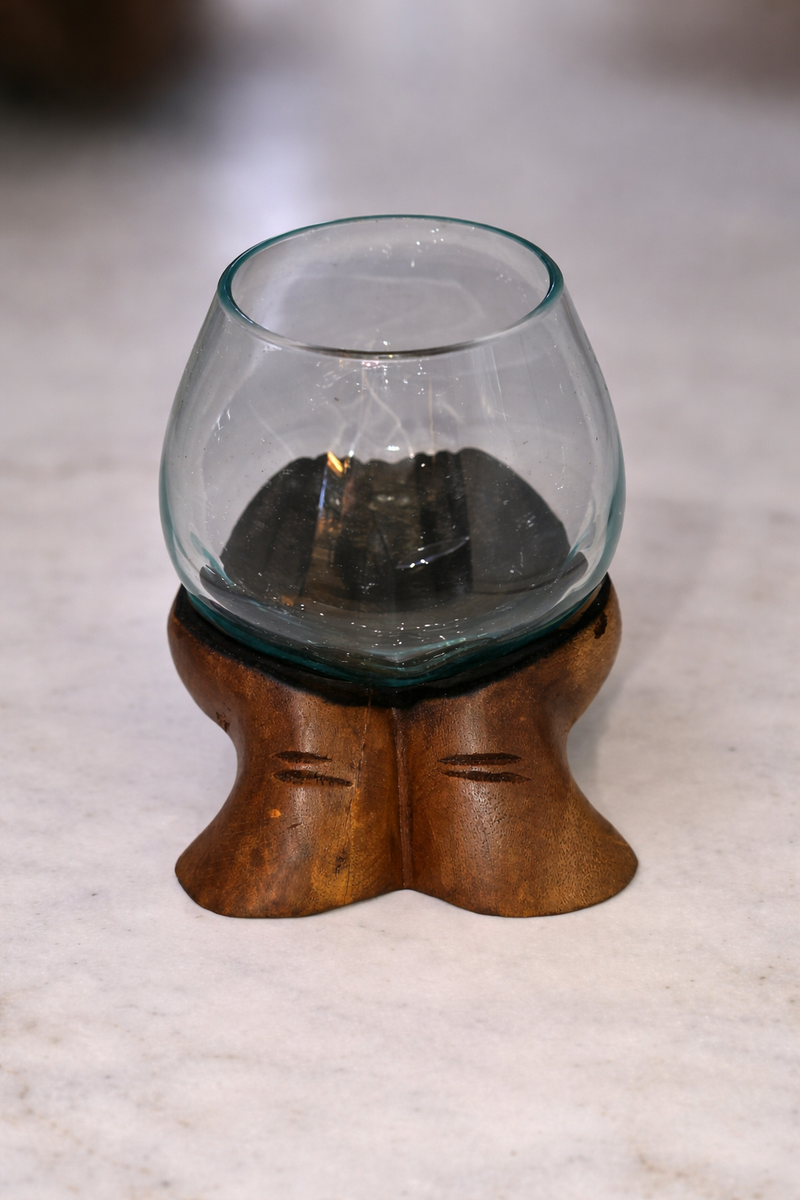 Slump vase on wooden carved hands